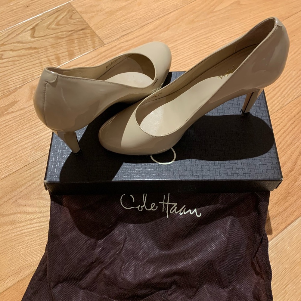 Cream colored Cole Hahn shoes.